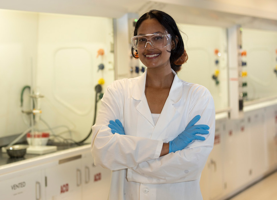 Shlesha Pradhan '25, student in white lab coat in Bennington science laboratory
