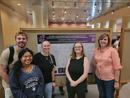 Emma Danylin '25, center, with her research team