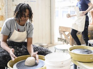 photo of students working with ceramics
