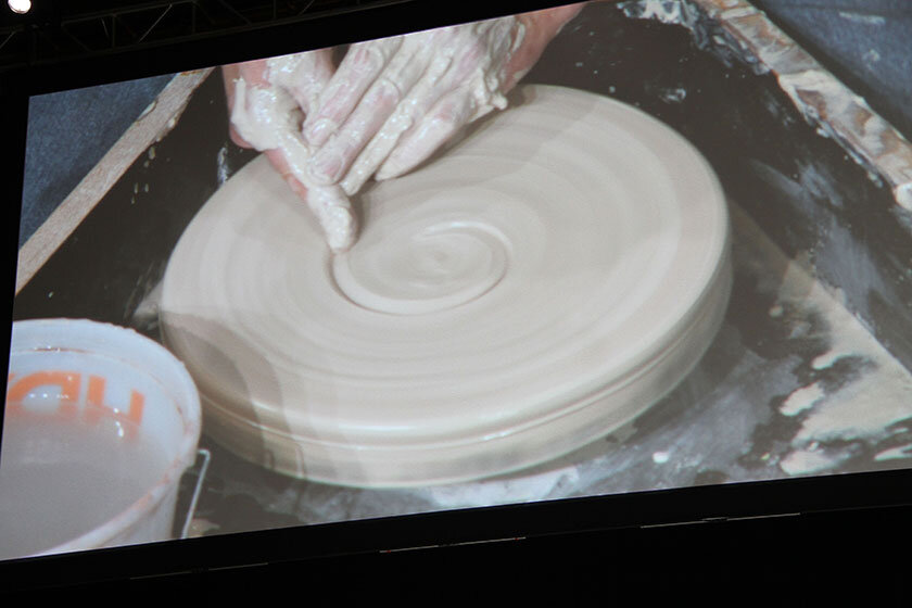 Photo of hand working with clay