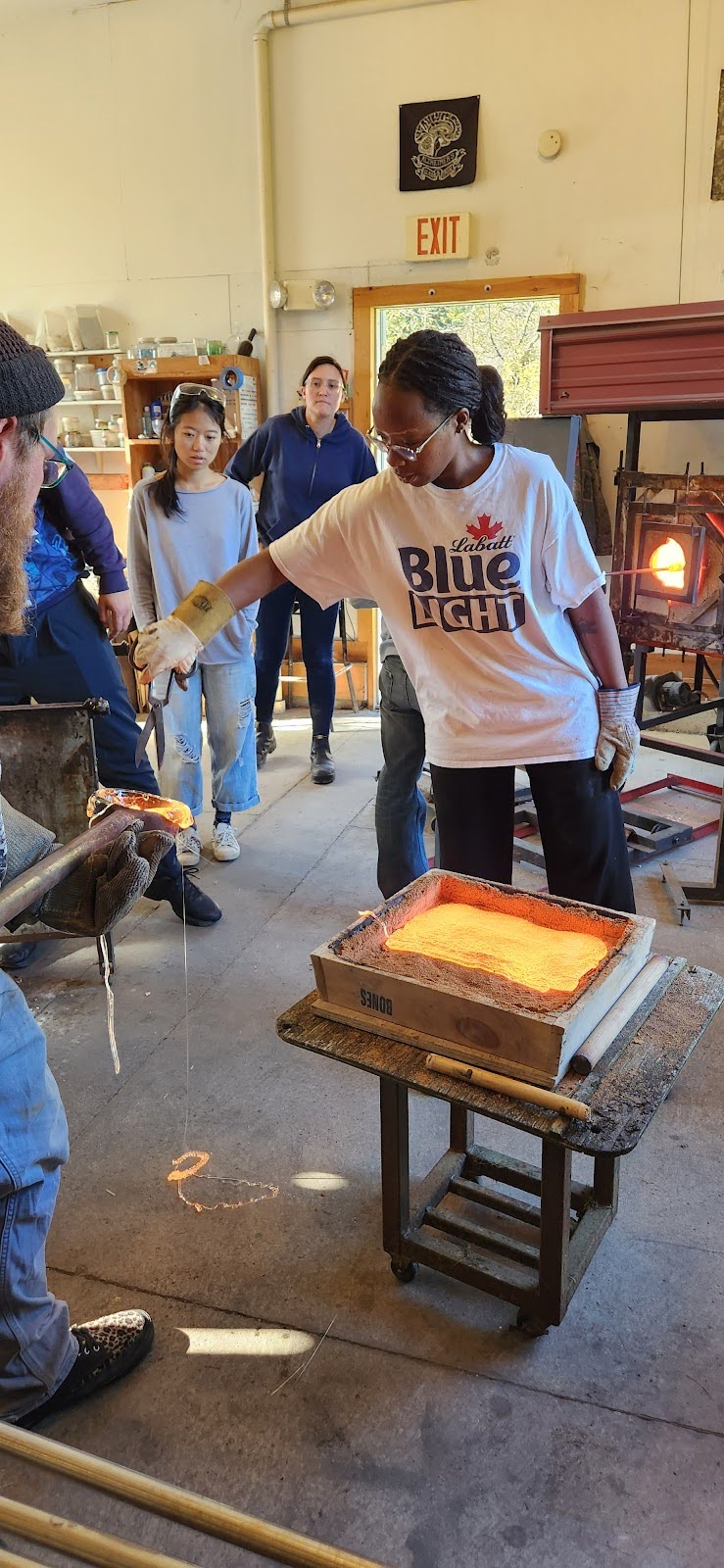 Image of student with melted glass