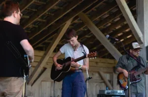 Image of Carling Berkhout playing guitar