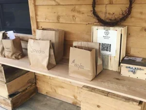 Paper bags on wooden shelf in a wooden room