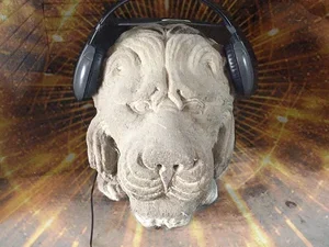 Stone lion with headphones on