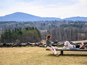 students in front of blue mountain landscape