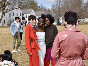 students taking a photo together on the lawn