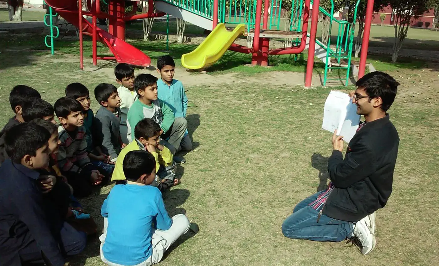 Muhammad Haroun teaching students during field work term