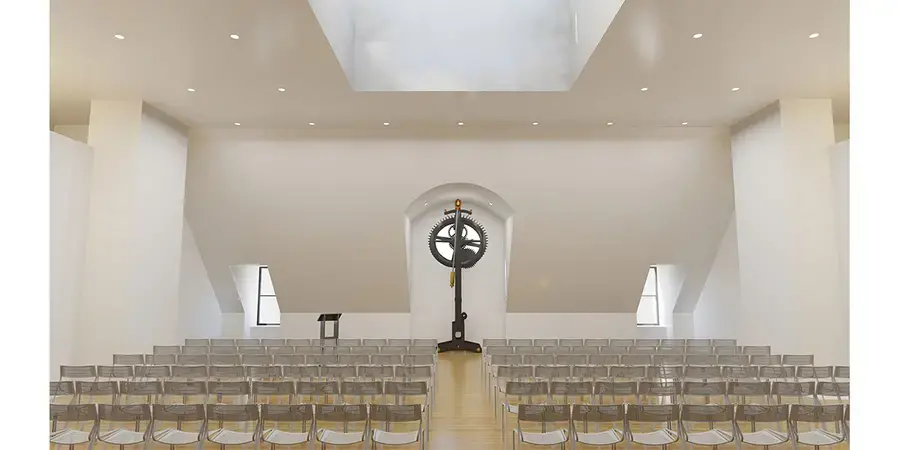 white room with rows of clear chairs
