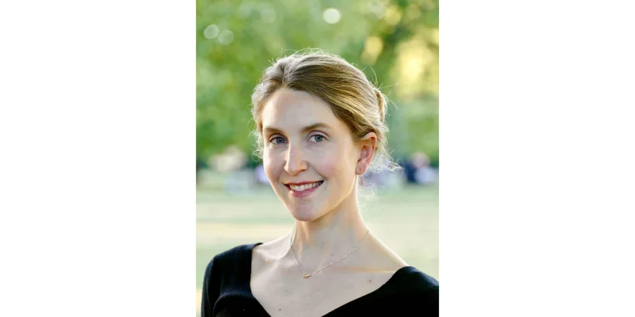 Meredith McLaughlin headshot outside with trees in background