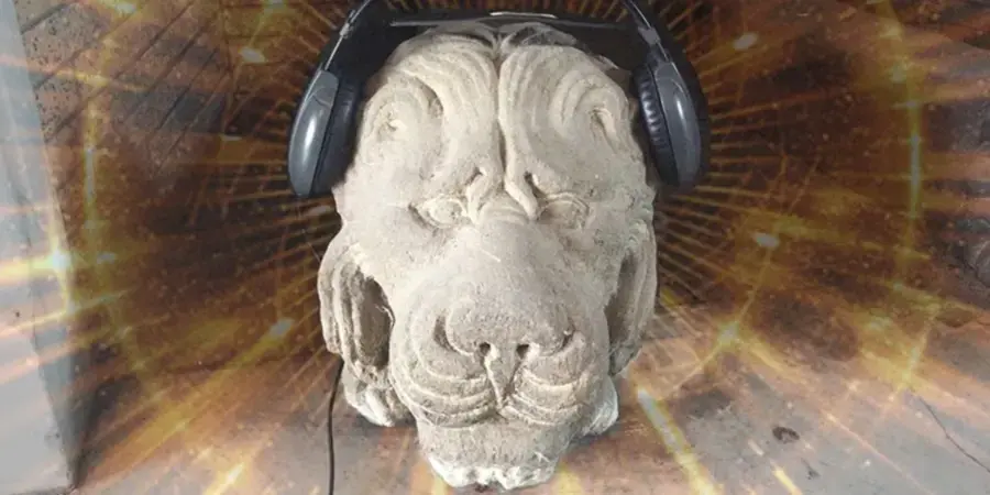 lion head made of stone wearing headsets