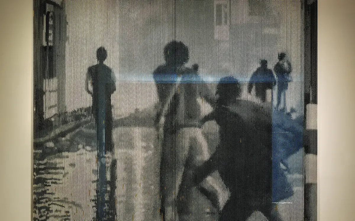 An art piece depicting a group of men, seen from behind, run down a street