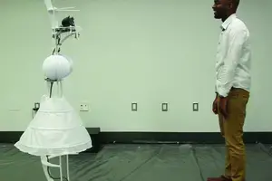 man and robot in a skirt