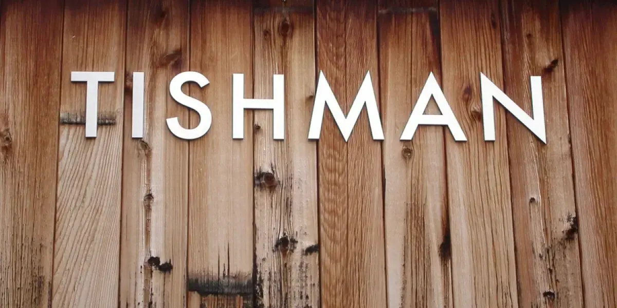Tishman sign on wood