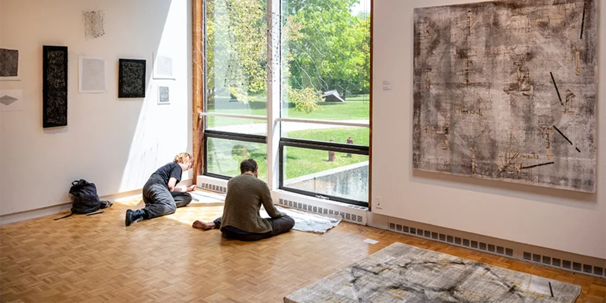 students drawing in an art gallery at Bennington