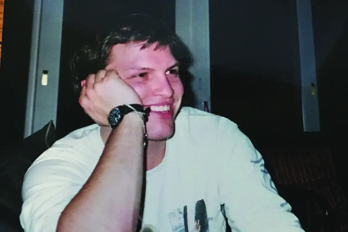 Matt Vohr, 1994, young man smiles at camera wearing a white teeshirt 
